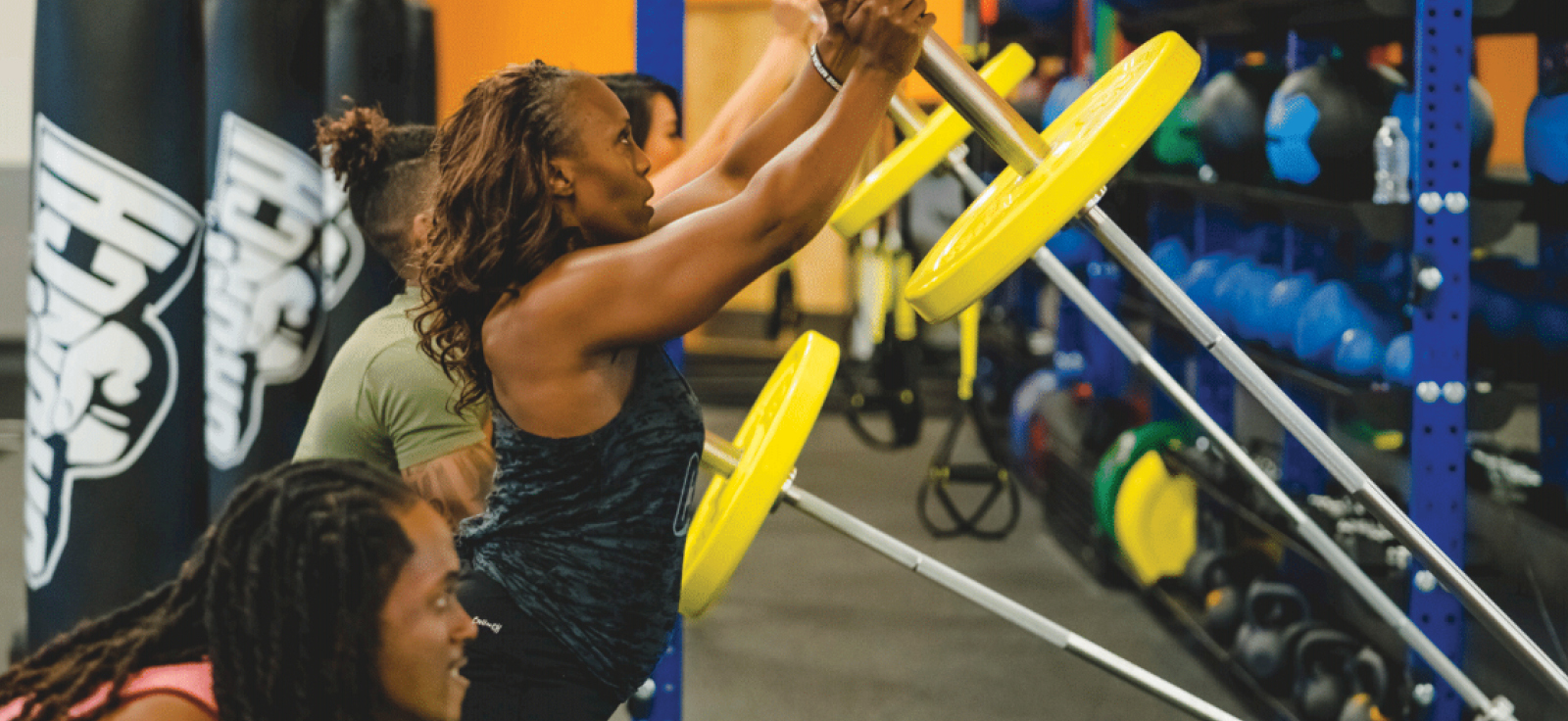 people in heavy metal hiit class at crunch